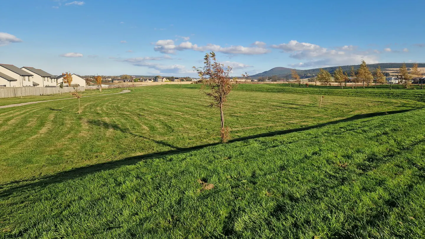 Broad maintained open space within a housing estate