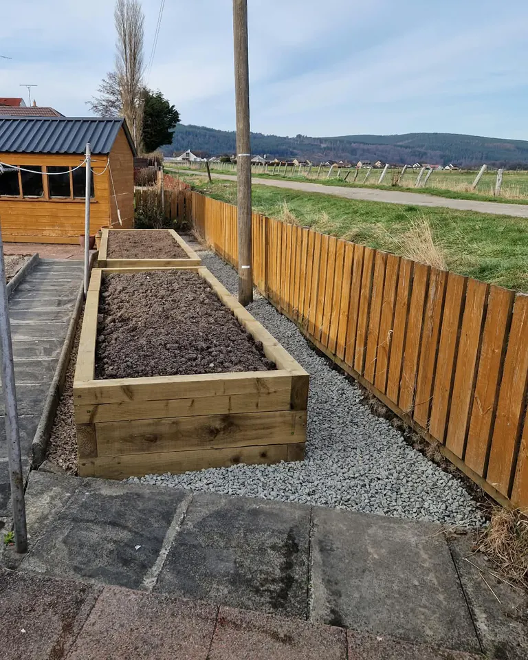 Prepared timber raised beds with gravel surrounds